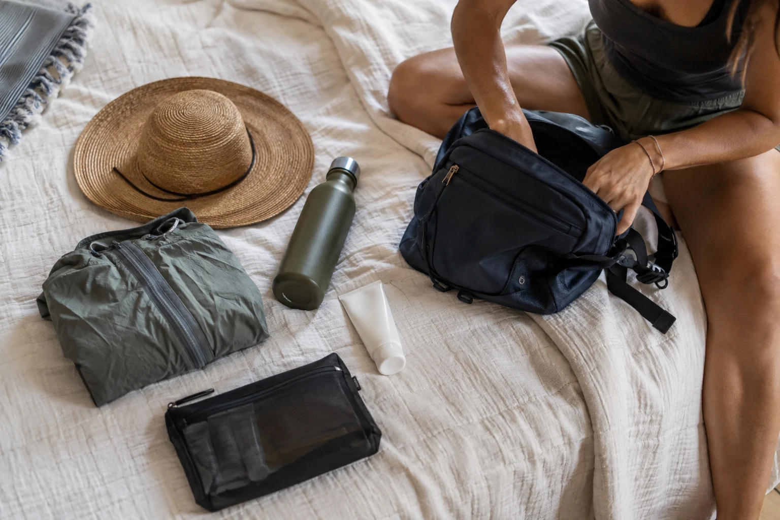 A compact day bag with water, rain protection and travel essentials
