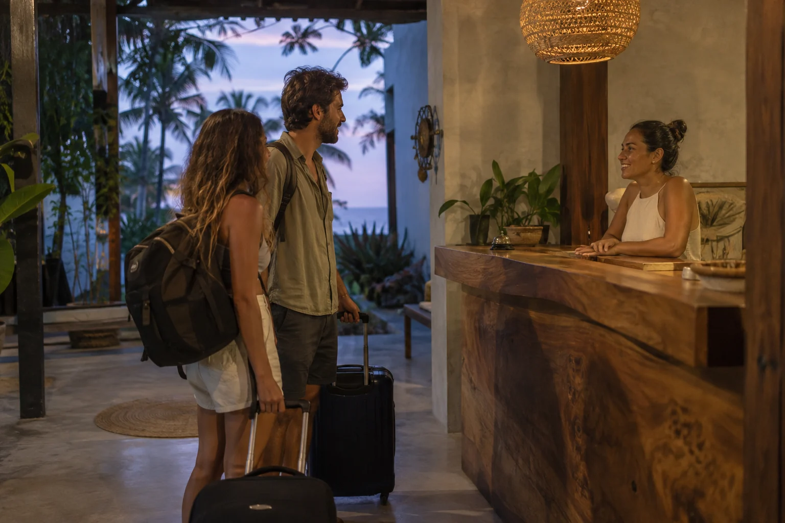 Travellers checking in at a guesthouse in the early evening