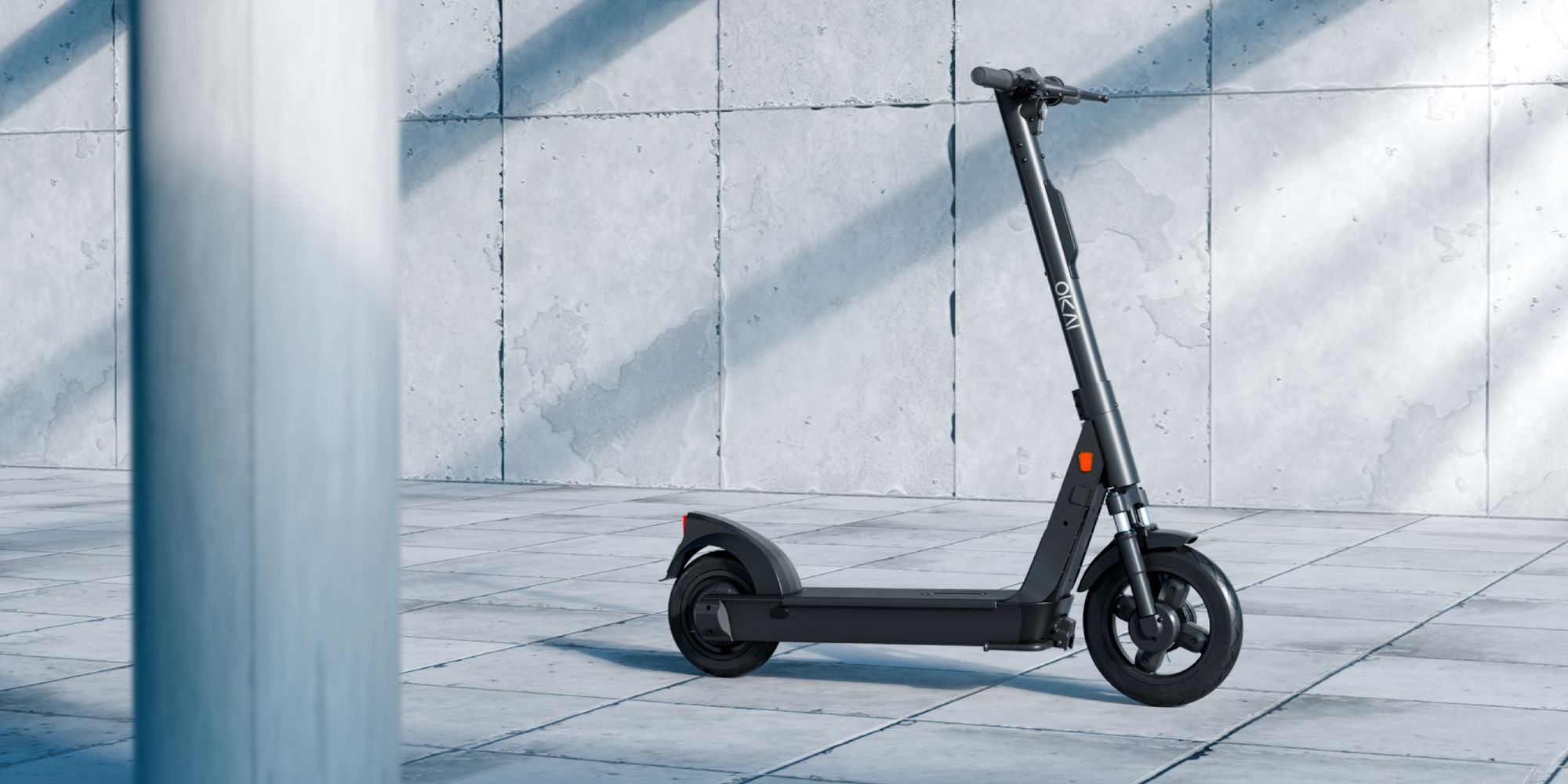 Official product photograph showing the shared electric scooter and front suspension